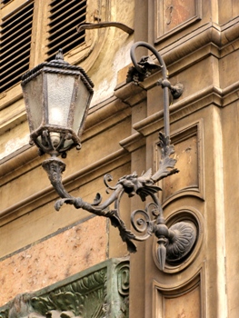 This photo of an exterior antique lighting fixture in Turin, Italy was taken by Italian photographer Rodolfo Belloli.